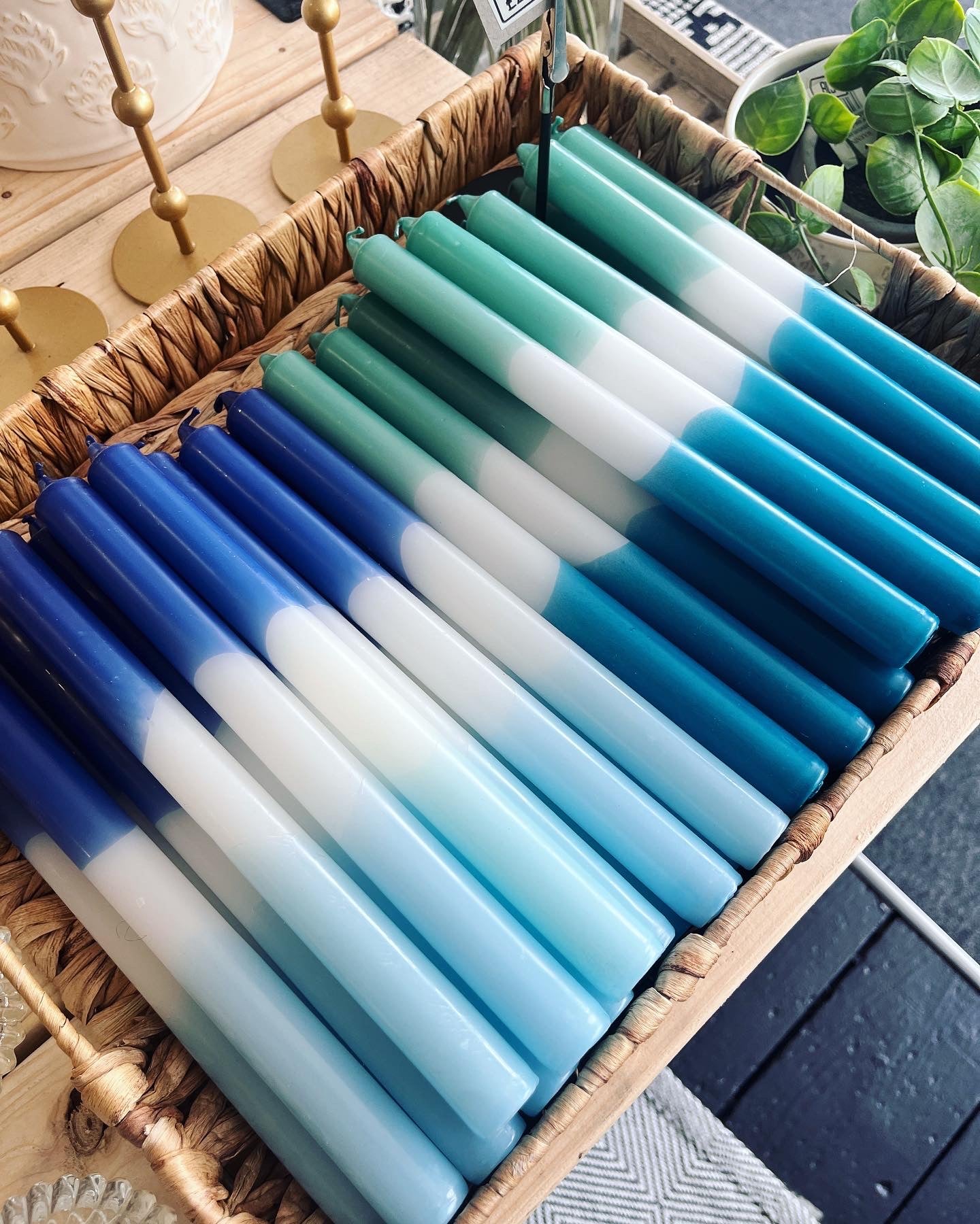 Taper candle in hues of blue.