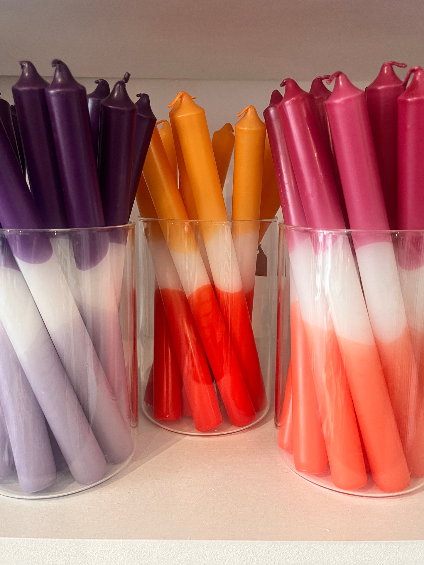 Taper candle in hues of pink and orange